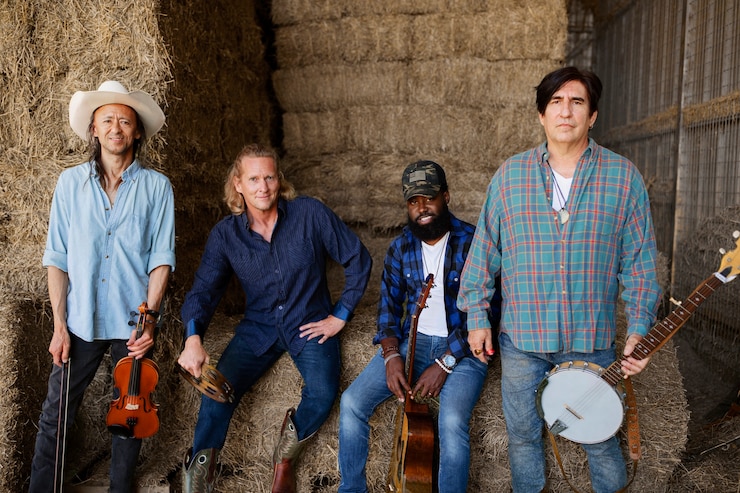 Men standing with musical instruments