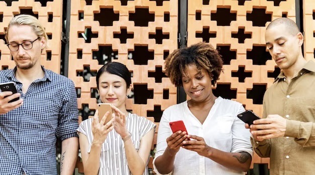 Group of diverse people using smartphones