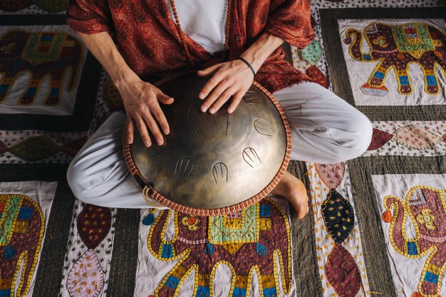 Close-up of a man's hand playing a musical instrument